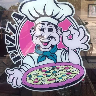 a chef holding a pizza