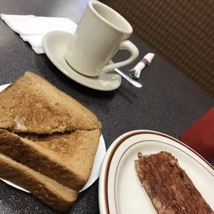 two slices of toast and a cup of coffee