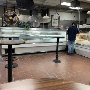 Inside the restaurant where carry out is located.