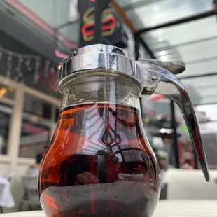 a pitcher of coffee on a table