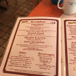 a menu and a cup of coffee