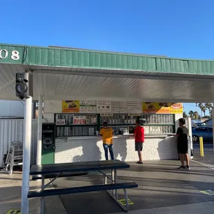 people waiting at a gas station