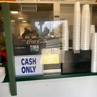 a cash only sign in a restaurant