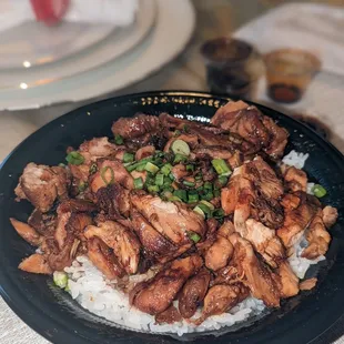 a plate of chicken and rice