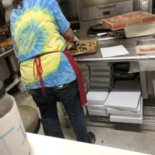 She is cutting up my pizza