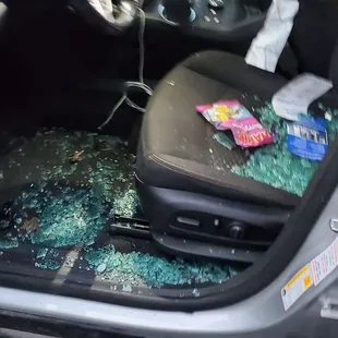 the interior of a car with shattered glass