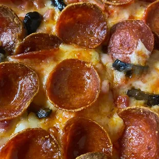 a pepperoni and olive pizza