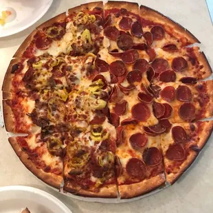 a pepperoni pizza on a table