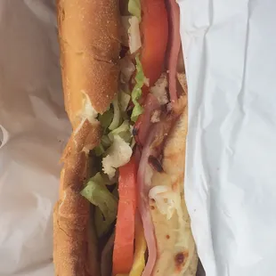 a sub sandwich wrapped in paper