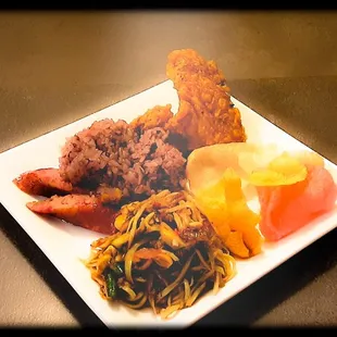 Chicken wings, Hmong sausage, sticky rice, papaya salad, and savory chip.