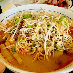 Chicken Kha Boun...best value at $8 and the bowl is HUGE! The veggie mix is legit when they give you banana blossom.