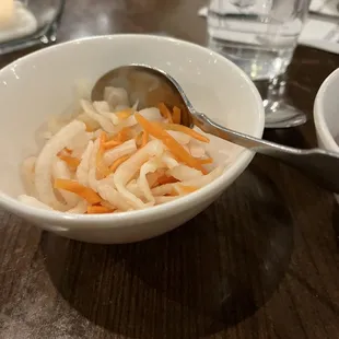 a bowl of noodles and carrots