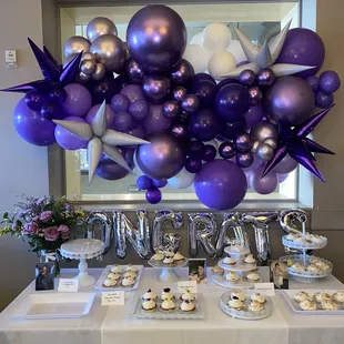 purple balloons and cupcakes