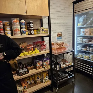 a man standing in front of a refrigerator