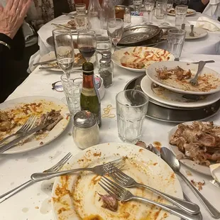 a table full of dirty dishes