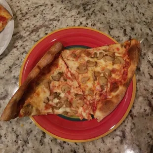a slice of pizza on a plate