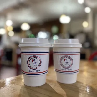 two coffee cups on a table