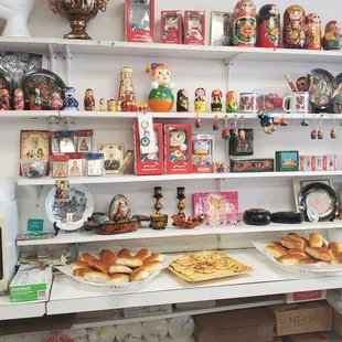 a shelf of russian souvens