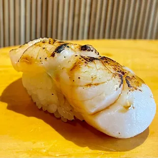 Seared scallop with a touch of soy from the chef