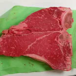 Thick and Juicy USDA beef Porterhouse Steak cut daily.