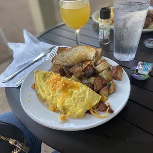 Bacon Cheddar Omelette with Roasted Potato and a Mango Mimosa