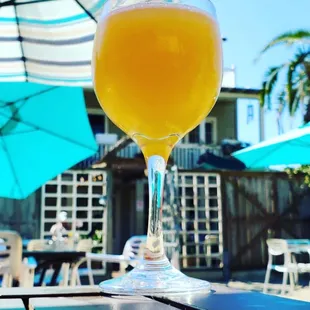 a glass of orange juice on a table