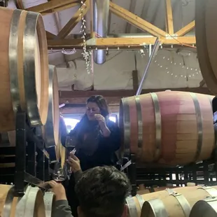 Owner letting us tap in a barrel of wine