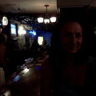 a woman sitting at a bar