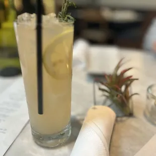 a glass of lemonade on a table