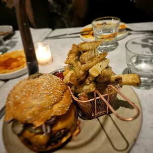 Charly Garcia Corner- Burger, cheddar, pickled cucumber, red onion, $20 or $29 with fries. Excellent