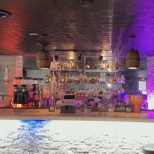 a bar with purple lighting