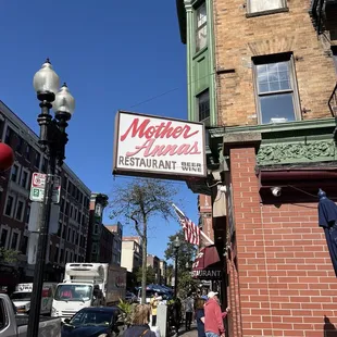 people walking down the sidewalk