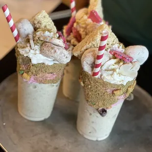 two ice cream sundaes on a tray