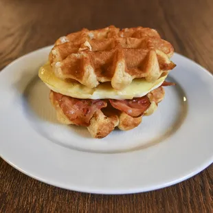 Waffle sandwich with egg, cheese and bacon