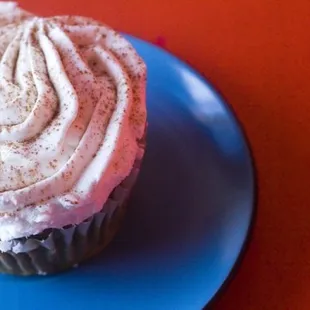 a cupcake on a blue plate