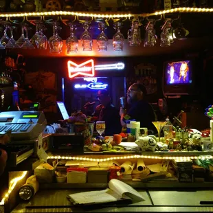 a bar with neon signs