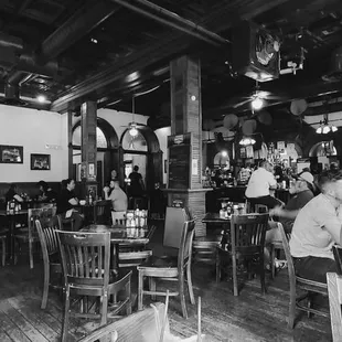 a black and white photo of a restaurant