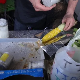 Spice up the roast corn with Cajun spice, salt, and parmesan cheese