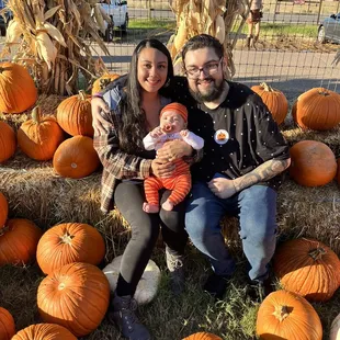 Family picture in the photo area with all the pumpkins in the front.