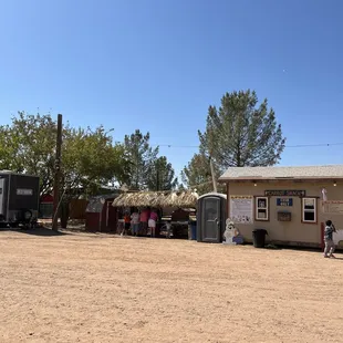 Farm kiosk to buy carrots to feed the animals. On the left are bathrooms and a handwashing station.