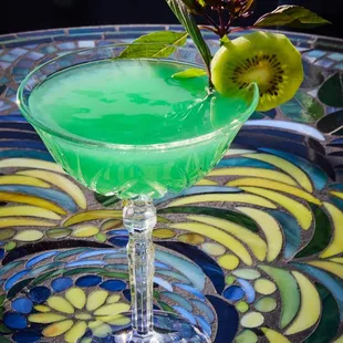 a green drink in a glass