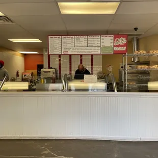 a woman behind the counter