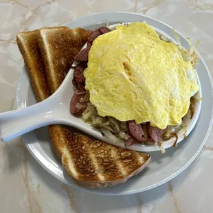 Here is our Polish Skillet topped with eggs and served with a side of toast.