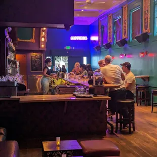 a group of people sitting at a bar
