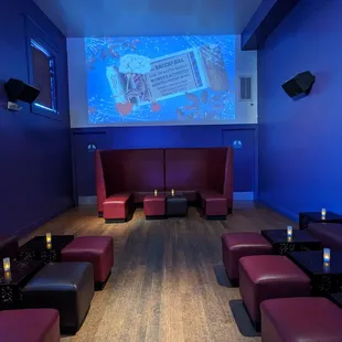 a large screen in the middle of a room