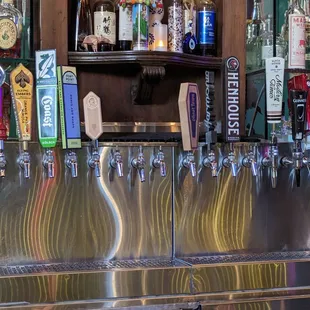 a bar with a bunch of beer taps