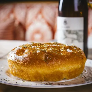 a plate of bread and a glass of wine