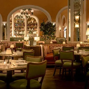 a dining area with tables and chairs