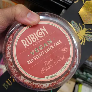 a person holding a jar of vegan