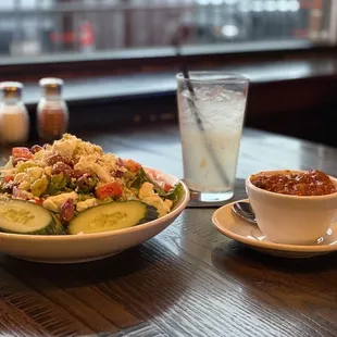a bowl of salad and a glass of water